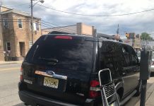 Police: Roque arrives in North Bergen after Newark SUV pulled over for hanging signs